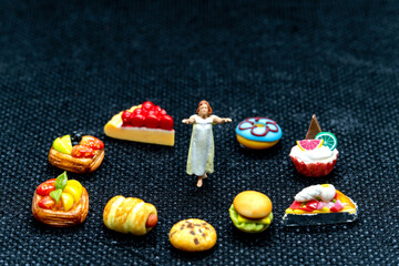 Miniature people Female sleepwalker in pajama dream about snack at night , Unhealthy concept