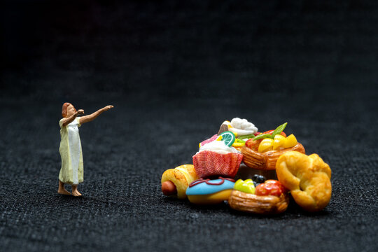 Miniature people Female sleepwalker in pajama dream about snack at night , Unhealthy concept