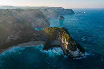Aerial drone shot panoramic view of rocky beach with cliff. Indian ocean shore. Copy space for...
