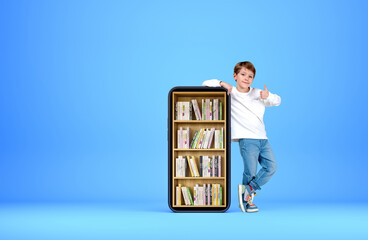 Boy show thumb up, phone with books on screen, blue background