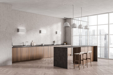 Light kitchen interior with countertop and seats, shelves and kitchenware, window