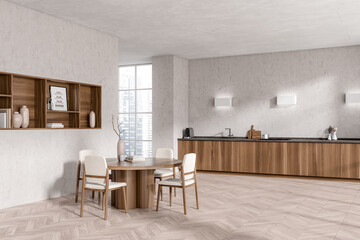 Light kitchen interior with table and seats, decoration and kitchenware, window