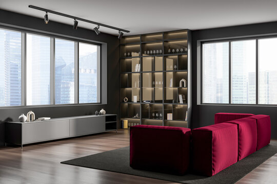 Dark living room interior with couch and shelf with decoration, panoramic window