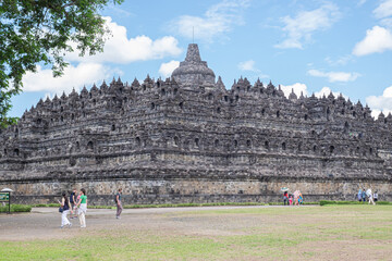 Magelang, Indonesia - June 3 2022: Visitors walking around the Borobudur courtyard. The official decided to closed the temple because being conserved.