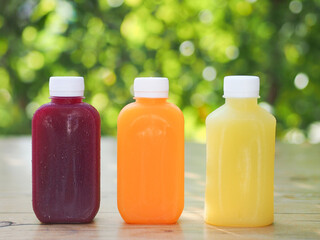 Healthy juice bottle with natural background.