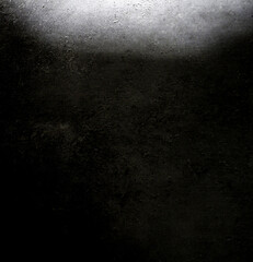 Seamless gray wall texture, bare cement wall, dark shadows and white light reflecting on the wall surface.