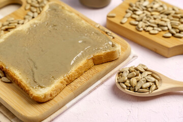 Fototapeta na wymiar Organic toast bread with healthy organic sunflower seed butter close up