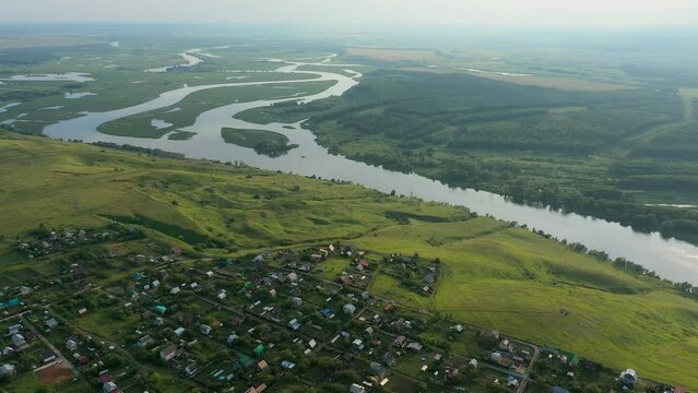 Picturesque views from the air and drone nature of Tatarstan and Russia. Sviyaga River. The river sprouts vegetation. Quiet ples stretch. Panorama for travel and tourism. Berry fields. From above. 