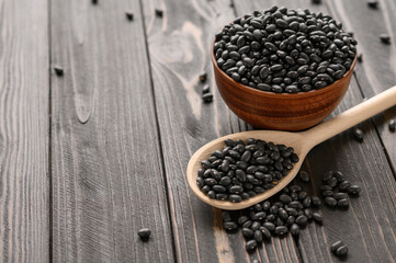Fresh organic natural beans on wooden rustic black background