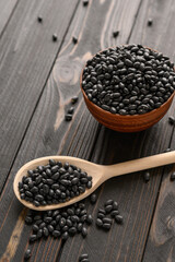 Fresh organic natural beans on wooden rustic black background