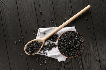 Fresh organic natural beans on wooden rustic black background