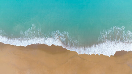 Summer tropical Beach sand copy space as a Beautiful sea waves  background,Top view