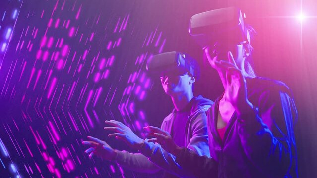 Metaverse digital world cyberspace futuristic technology, man and woman waring VR google virtual reality game playing neon futuristic background