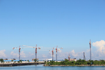 crane by the sea with blue sky