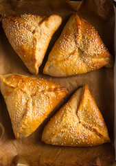 pies with cheese on the baking tray