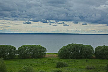 Fototapeta na wymiar Cloudy sky over Pleshcheevo lake.