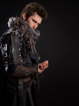 A guy in a steampunk or post-apocalyptic image, portrait on a black background