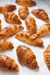 croissants on a textured white fabric