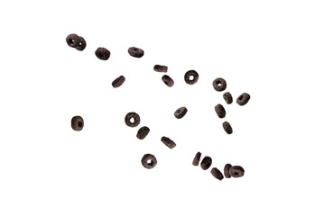 Chocolate rings cereal spill out into a bowl. Breakfast.