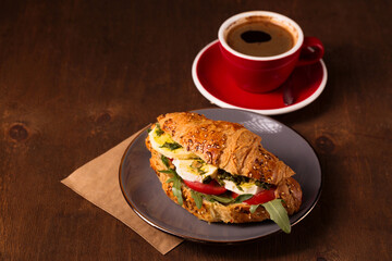 Croissant with filling and fragrant coffee
