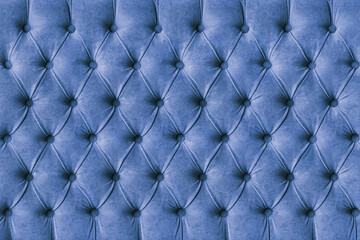 Blue capitone checkered soft fabric textile decorative background with buttons. Classic retro...