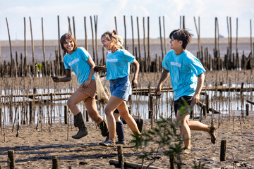 Team of young and diversity volunteer worker group enjoy charitable social work outdoor in cleaning...