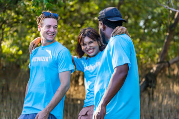 Team of young and diversity volunteer worker group enjoy charitable social work outdoor in mangrove...