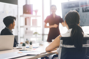 Obraz premium ear view of businesswoman sitting in boardroom.