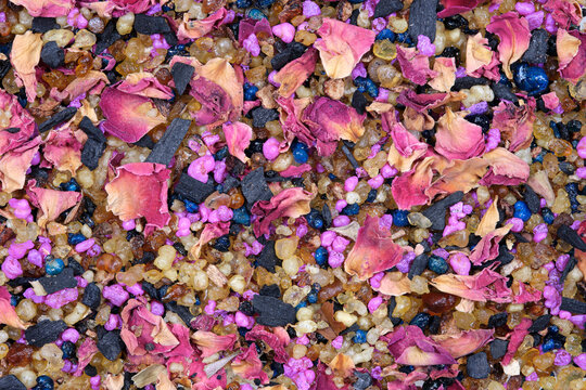 Mixture of dried rose petals, frankincense, styrax and other resins for burning incense, photographed from above