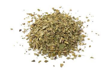 Heap of South American dried Mate tea leaves close up isolated on white background