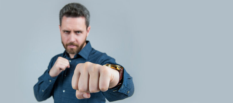 Mature Man Stand In Offensive Fighting Position With Clenched Fist Selective Focus, Power. Man Face Portrait, Banner With Copy Space.