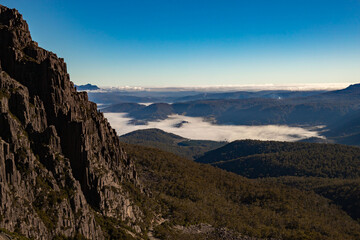 Landscape from ben lemond national park Tasmania / Australia with the fog  from the morning on the top of the forest