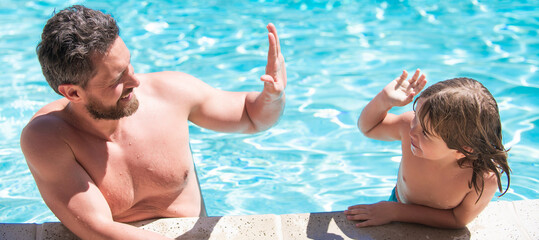 Fototapeta premium Father and son in swimming pool, banner with copy space. take five. daddy with kid boy on spa resort.