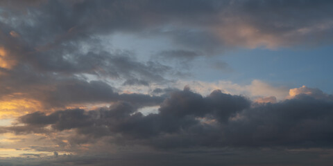 Dramatic sunset with dark stormy clouds