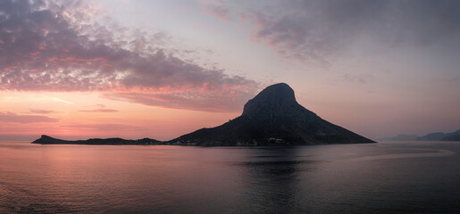 Sunset view of Telendos island. Aegean Sea, Greece.