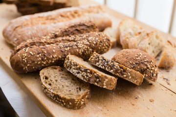 fresh loaf of bread on wooden board