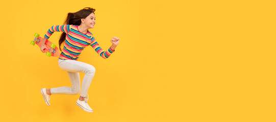 Run and jump. happy energetic teen girl skateboarder jumping with penny board skateboard, pennyboard. Casual teen child horizontal poster. Banner header, copy space. © Olena