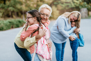 Mother and grandmother came to pick up children at school.