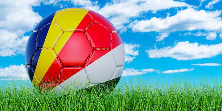 Soccer ball with Seychelloise flag on the green grass against blue sky, 3D rendering
