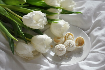 bouquet of white tulips with candies