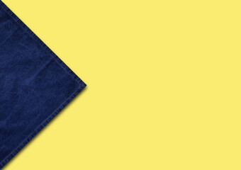 Blue napkin, tablecloth, fabric texture isolated on yellow.