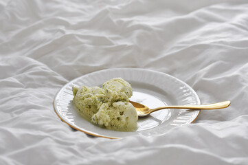 tasty pistachio ice cream on a plate