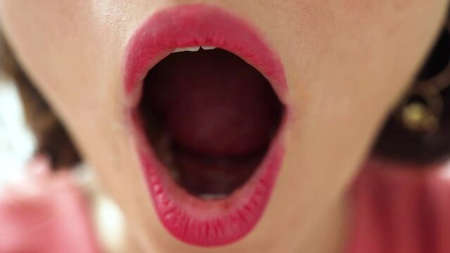 Close-up woman lips excited surprised and amazed with open mouth, shocked woman can't believe her eyes