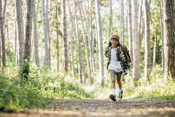 Girl scout running in the woods