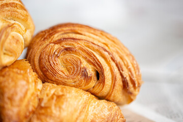 Croissant macro. French croissant with waves. Air baking. Croissant for puff pastry advertising. Croissant for a magazine.French breakfast with pastries. From puff pastry. Bun from France. Roll macro
