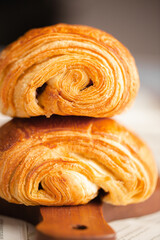 Croissant macro. French croissant with waves. Air baking. Croissant for puff pastry advertising. Croissant for a magazine.French breakfast with pastries. From puff pastry. Bun from France. Roll macro