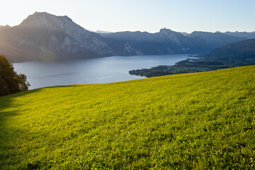Peaceful autumn Alps mountain lake. Sunrise view to Traunsee lake, Gmundnerberg, Altmunster am Traunsee, Upper Austria.