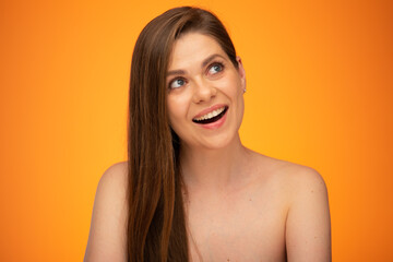 Laughing woman with long hair and bared shoulders looking up. Isolated female person portrait.