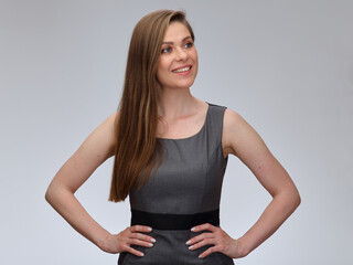 Smiling business woman looking away, isolated portrait of young business woman with long hair.