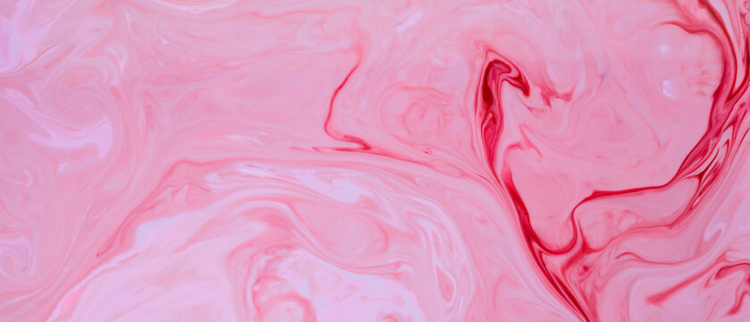Abstract pink background made with fluid art technique. Liquid colorful backdrop. Fluid art wallpaper
